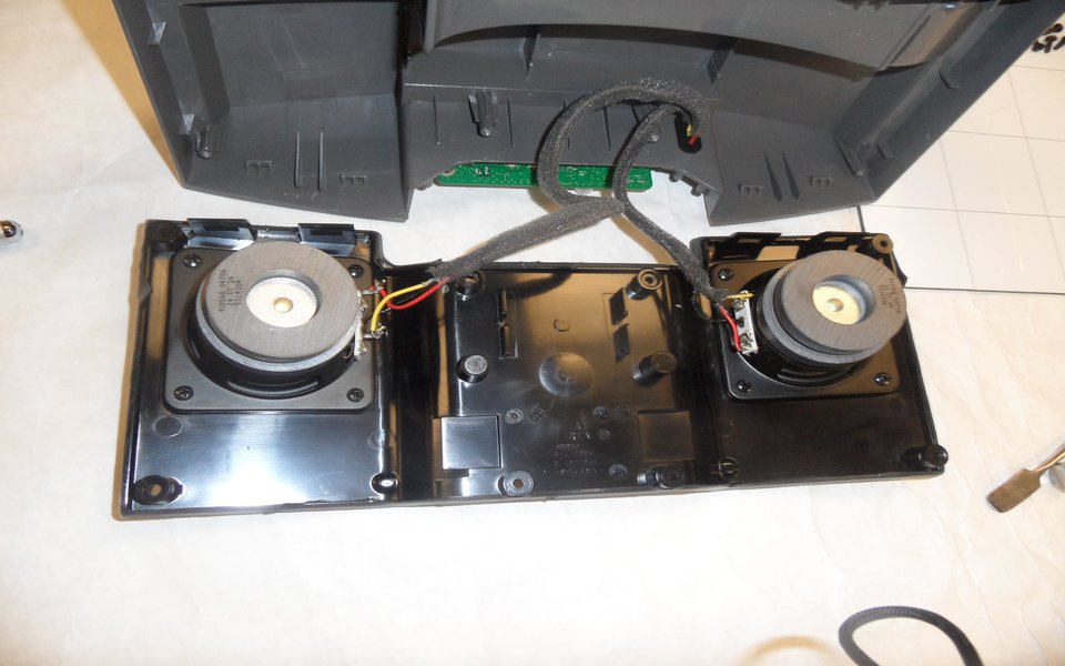 Portable speaker opened up with its drivers exposed