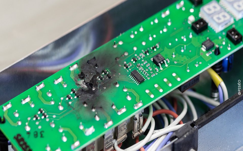 Circuit board with visible burn damage